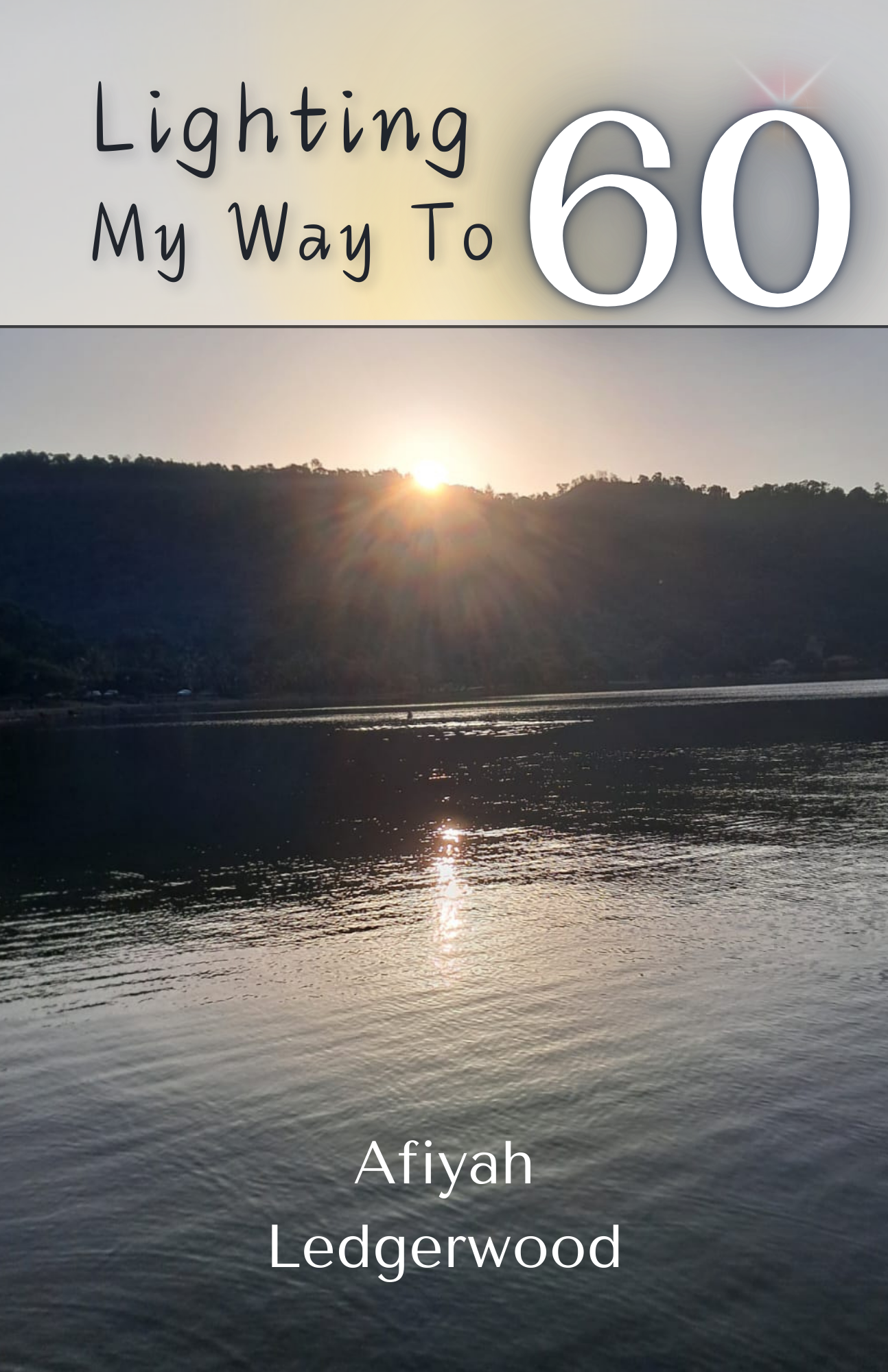 Lighting My Way to 60 Cover Image- the sun rising over the hills and sea